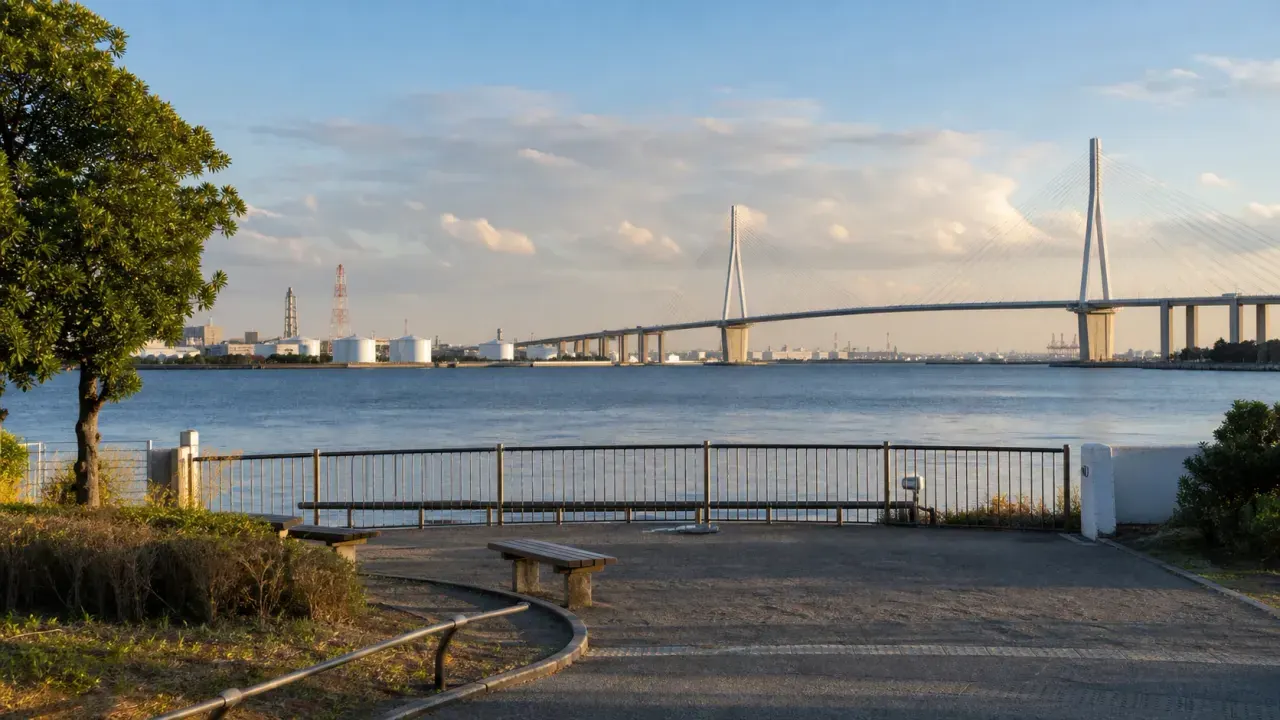 海に面した小さな駅前公園から京浜運河と工場地帯の橋を眺める、海芝公園をイメージしたカバー画像